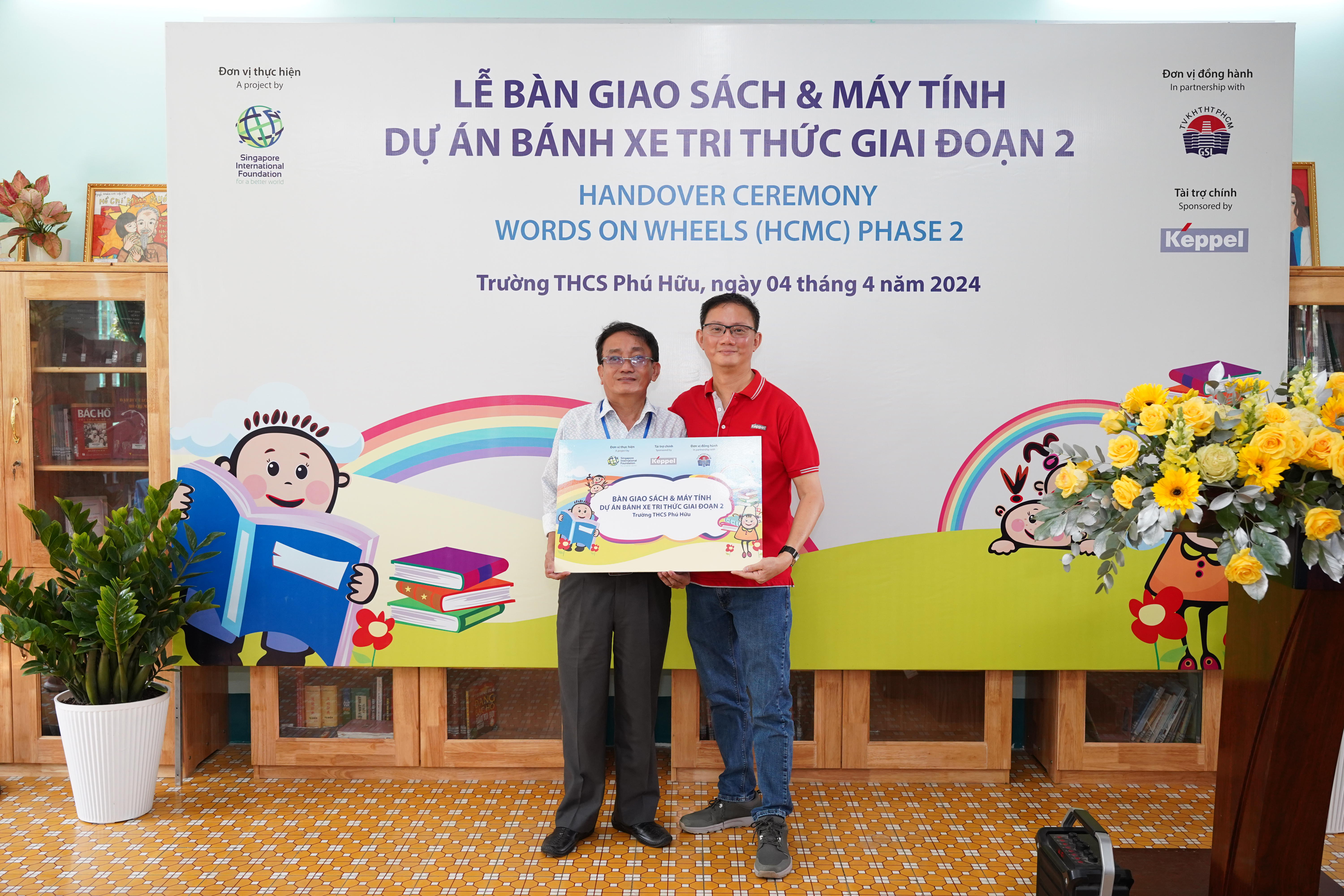 Mr Joseph Low and the Principal of Phu Huu secondary school 1.png