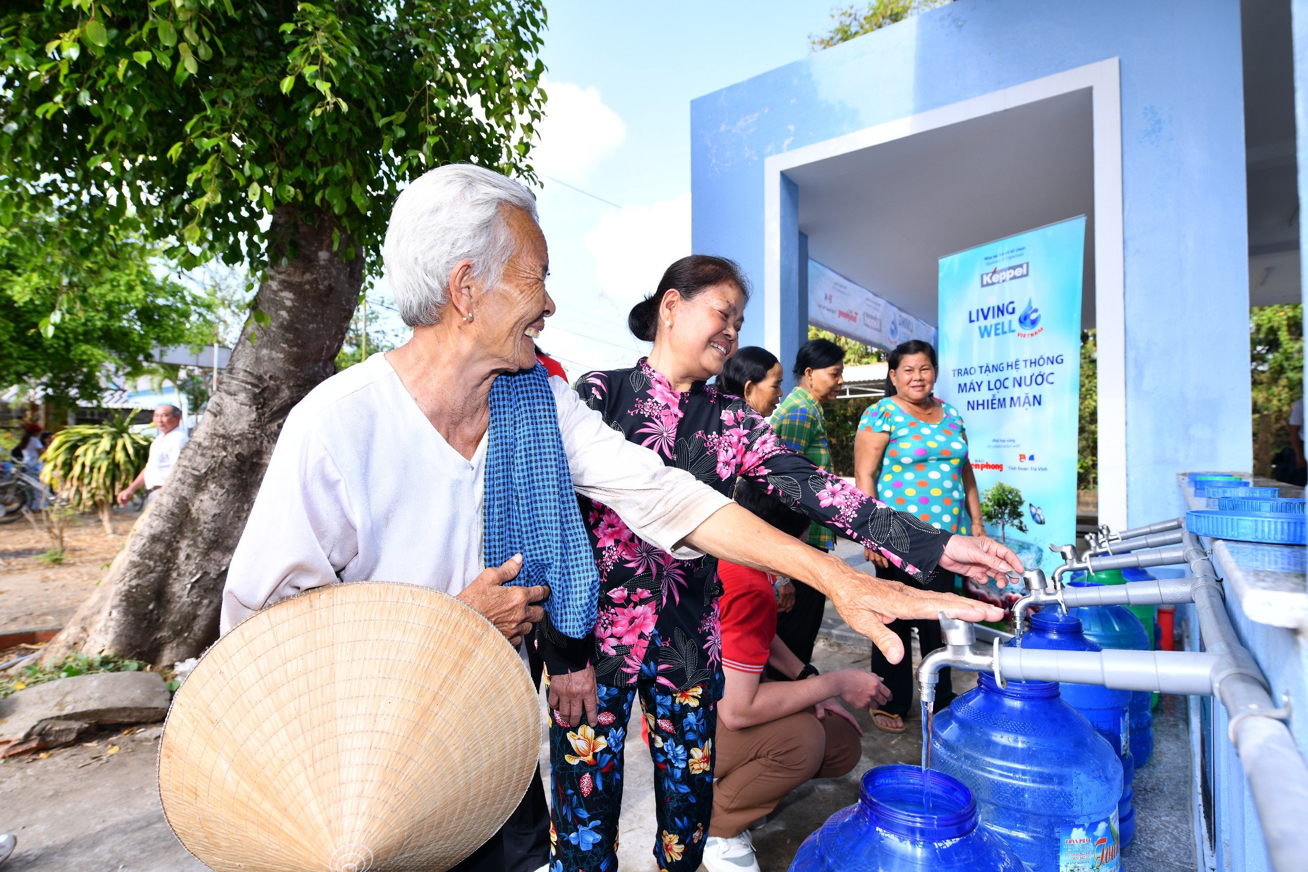 The villagers getting clean water from the system.jpg